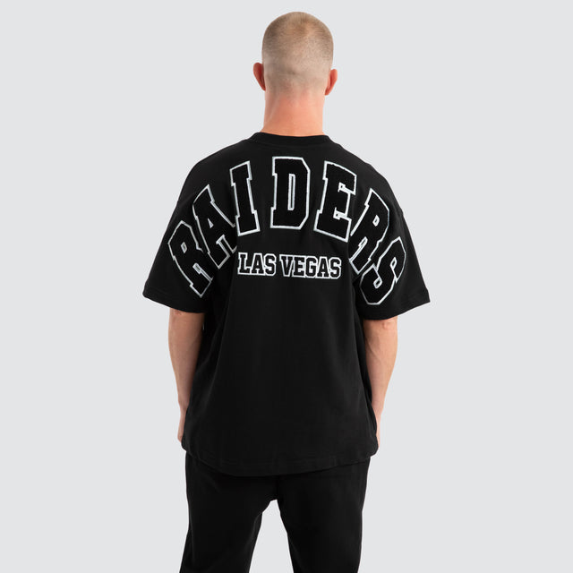 Model Wears Las Vegas Raiders Surround Loopback Tee Jet Black T-Shirts in Black - Image 1