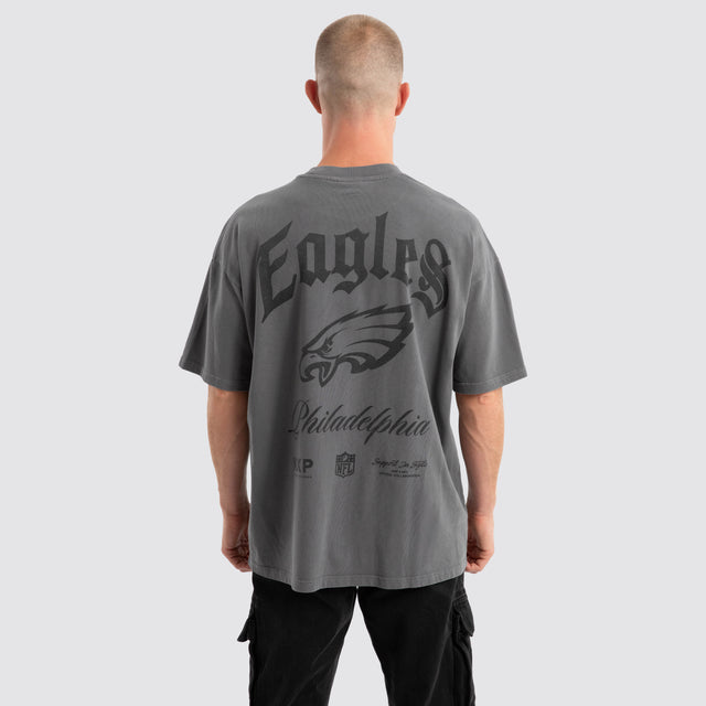 Model Wears Philadelphia Eagles Defence Raptor Tee Pigment Charcoal T-Shirts in Grey - Image 1