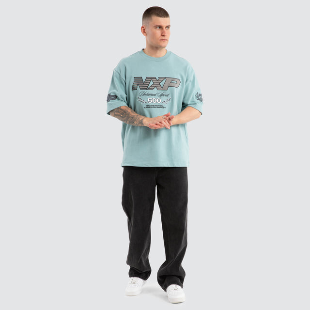 Model Wears Bounty Loopback Oversized Tee Aquifer T-Shirts in Blue - Image 2