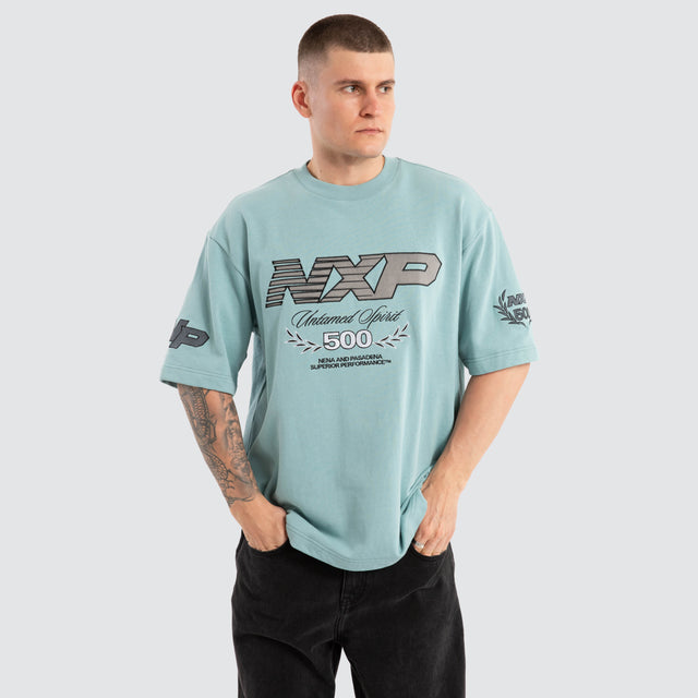 Model Wears Bounty Loopback Oversized Tee Aquifer T-Shirts in Blue - Image 1