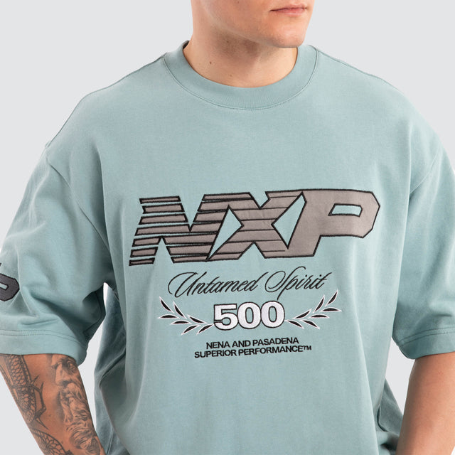 Model Wears Bounty Loopback Oversized Tee Aquifer T-Shirts in Blue - Image 3