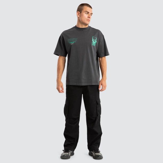 Model Wears Trait Street Tee Pigment Asphalt T-Shirts in Grey - Image 2