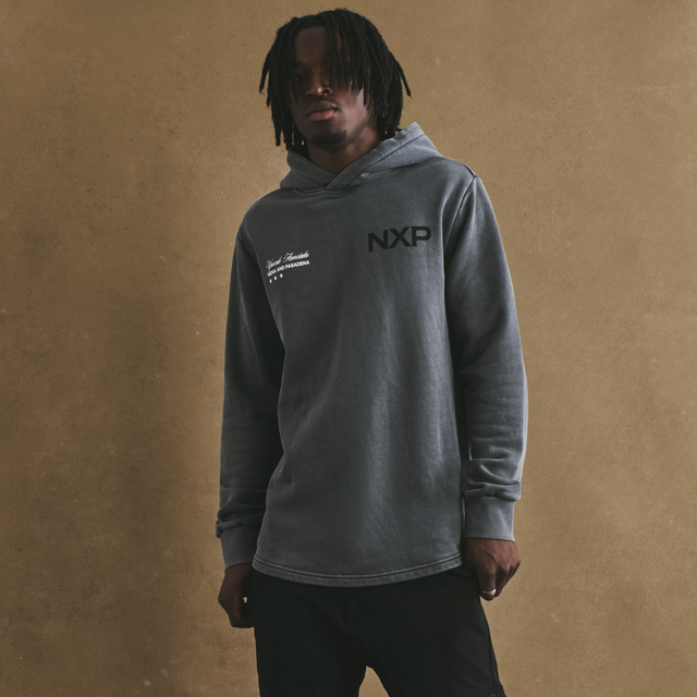 Model Wears Duster Dual Curved Hoodie Pigment Charcoal Hoodies in Grey - Image 2