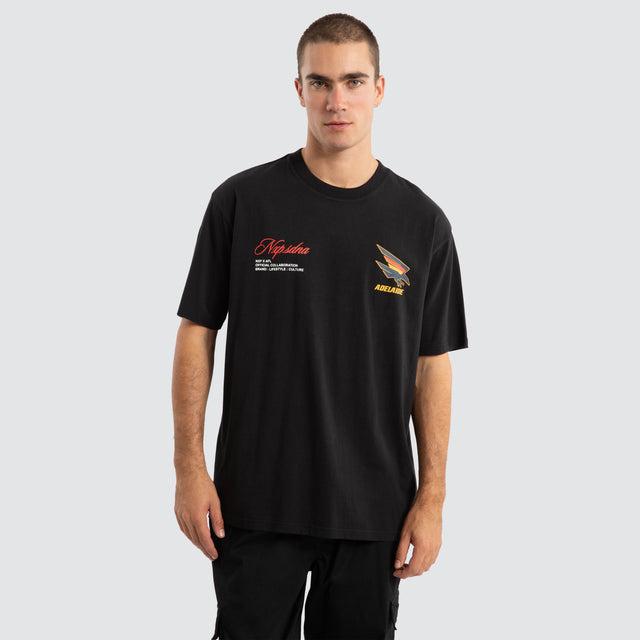 Model Wears Adelaide Crows AFL Season Tee Jet Black T-Shirts in Black - Image 2
