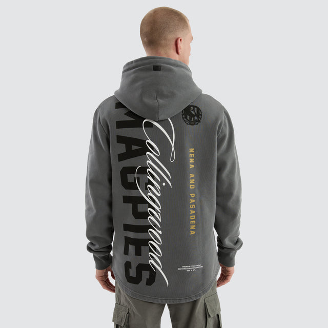 Model Wears Collingwood Magpies Grand Hoodie Pigment Charcoal Hoodies in Grey - Image 1