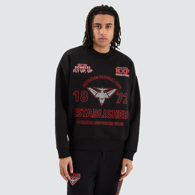 Model Wears Essendon Bombers AFL Box Fit Sweater Jet Black Jumpers in Black - Image 5