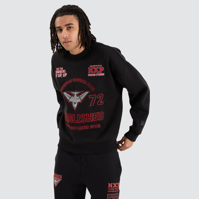 Model Wears Essendon Bombers AFL Box Fit Sweater Jet Black Jumpers in Black - Image 1