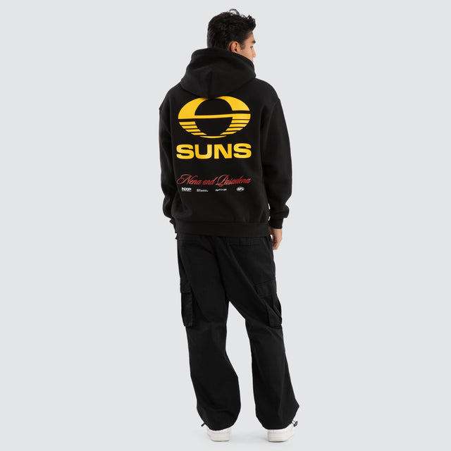 Model Wears Gold Coast Suns AFL Season Hoodie Jet Black Hoodies in Black - Image 5