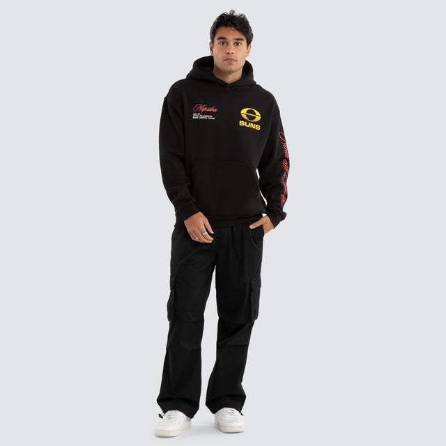 Model Wears Gold Coast Suns AFL Season Hoodie Jet Black Hoodies in Black - Image 6