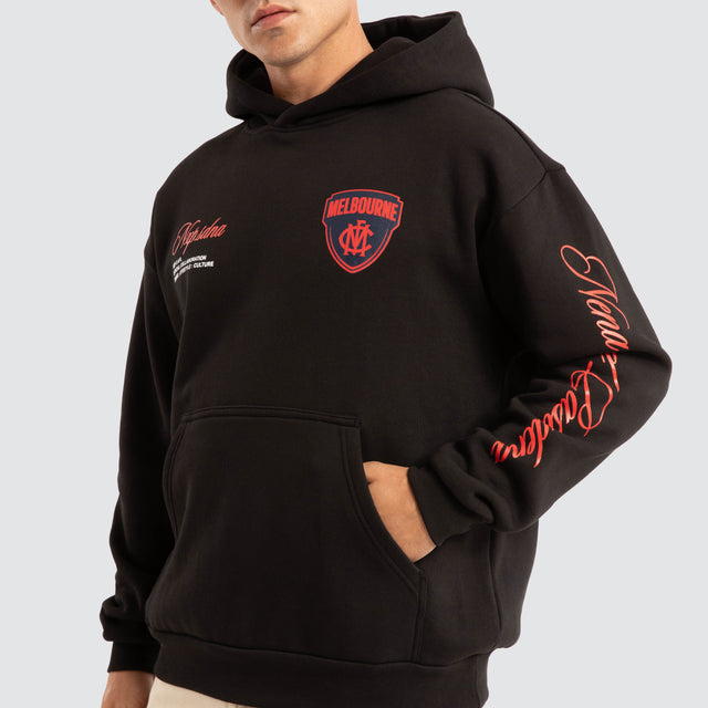 Model Wears Melbourne Demons AFL Season Hoodie Jet Black Hoodies in Black - Image 3
