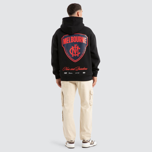 Model Wears Melbourne Demons AFL Season Hoodie Jet Black Hoodies in Black - Image 5