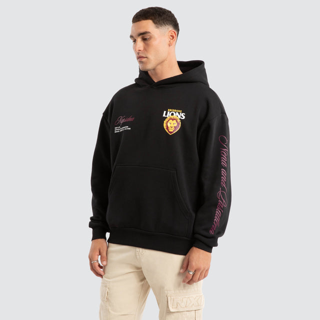 Model Wears Brisbane Lions AFL Season Hoodie Jet Black Hoodies in Black - Image 4