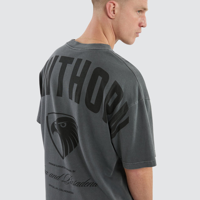 Model Wears Hawthorn Hawks Hunter Tee Pigment Charcoal T-Shirts in Grey - Image 7
