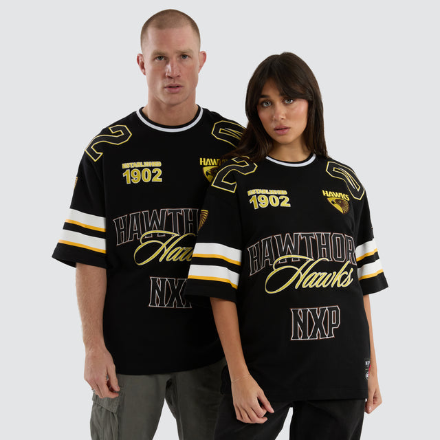 Model Wears Hawthorn Hawks League Loopback Tee Jet Black T-Shirts in Black - Image 2