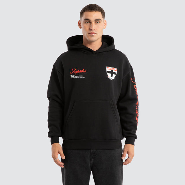 Model Wears St Kilda Saints AFL Season Hoodie Jet Black Hoodies in Black - Image 2