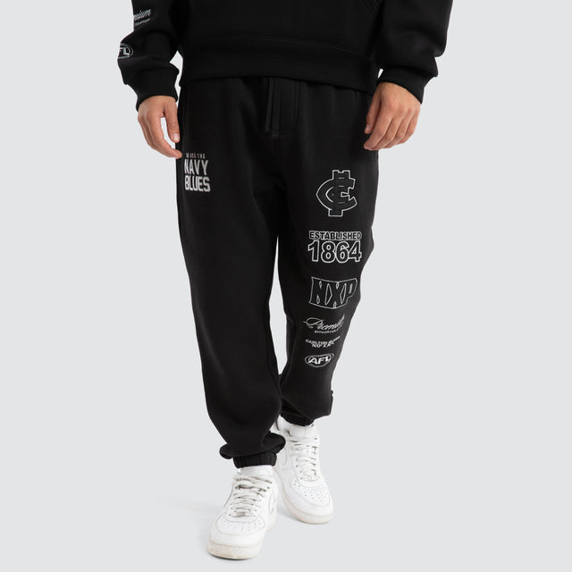 Model Wears Carlton Blues AFL Mono Trackpants Jet Black Trackpants in Black - Image 1