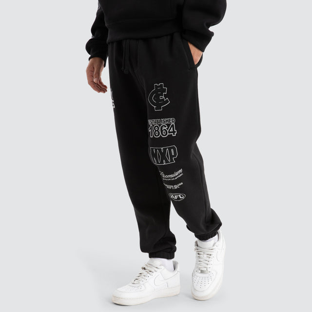 Model Wears Carlton Blues AFL Mono Trackpants Jet Black Trackpants in Black - Image 2