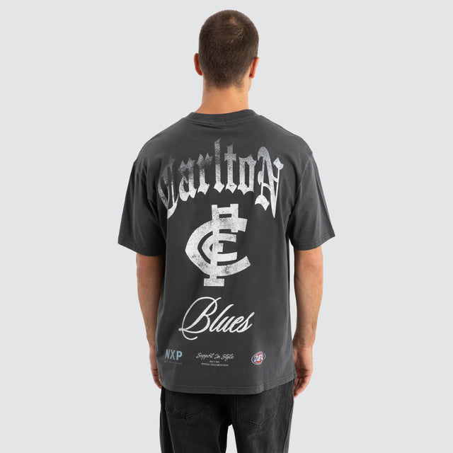 Model Wears Carlton Blues AFL Vintage Goth Tee Pigment Asphalt T-Shirts in Grey - Image 1