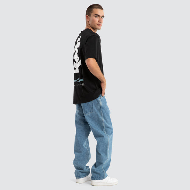 Model Wears Carlton Blues AFL Season Tee Jet Black T-Shirts in Black - Image 5