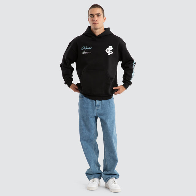 Model Wears Carlton Blues AFL Season Hoodie Jet Black Hoodies in Black - Image 3