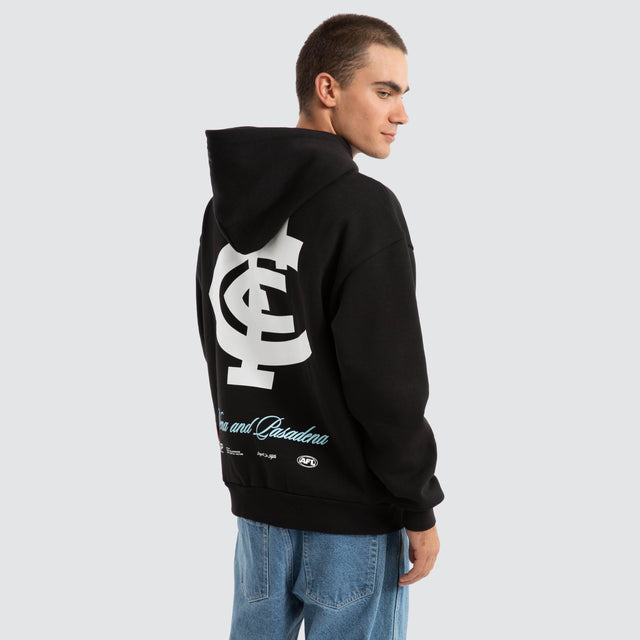 Model Wears Carlton Blues AFL Season Hoodie Jet Black Hoodies in Black - Image 1