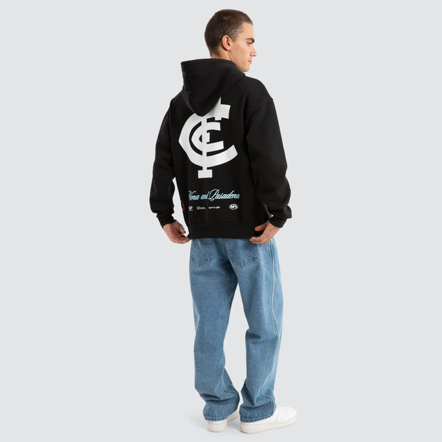Model Wears Carlton Blues AFL Season Hoodie Jet Black Hoodies in Black - Image 5
