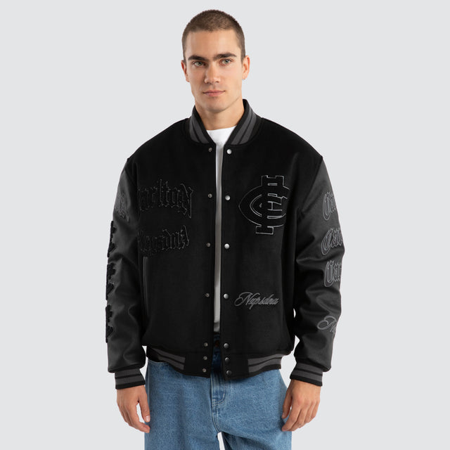 Model Wears Carlton Blues AFL Ace Varsity Jacket Jet Black Jackets in Black - Image 5