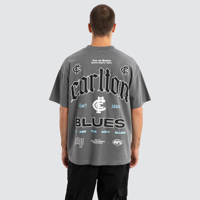 Model Wears Carlton Blues AFL Stack Tee Pigment Charcoal T-Shirts in Grey - Image 1