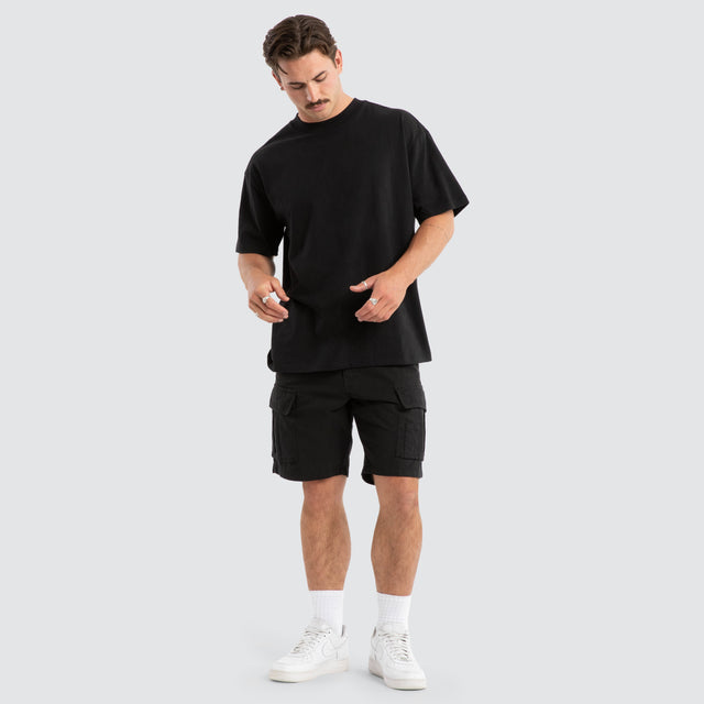 Model Wears Colby Cargo Shorts Black Shorts in Black - Image 2