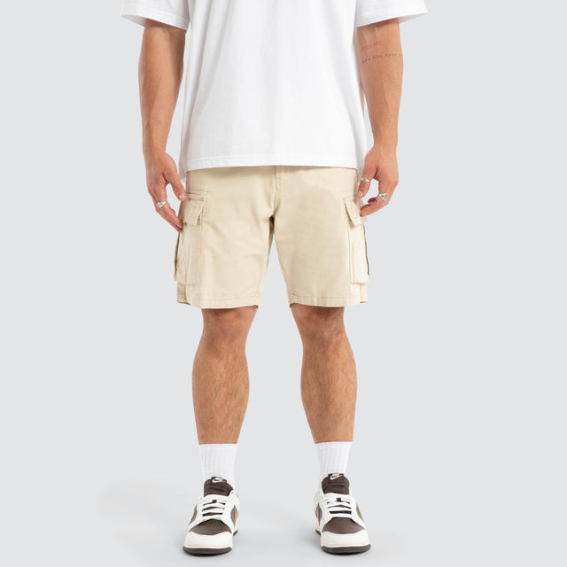 Model Wears Colby Cargo Shorts Bone Shorts in Beige - Image 1