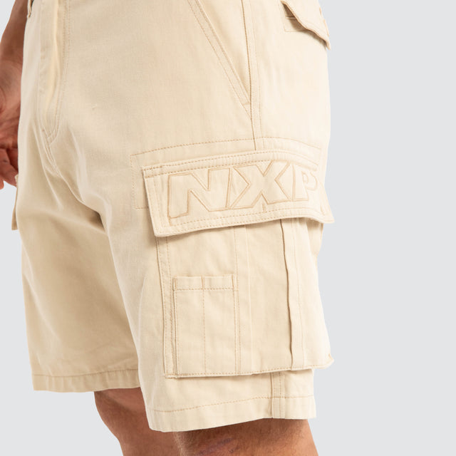 Model Wears Colby Cargo Shorts Bone Shorts in Beige - Image 2