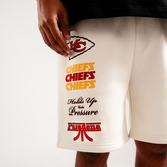 Model Wears Kansas City Chiefs NFL Shorts Tofu Shorts in Off-White - Image 2