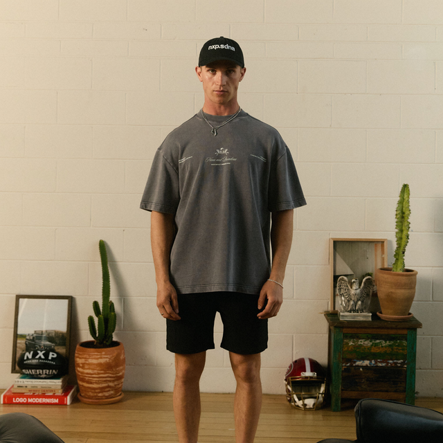 Model Wears Date Night Loopback Raptor Tee Mineral Asphalt T-Shirts in Grey - Image 2