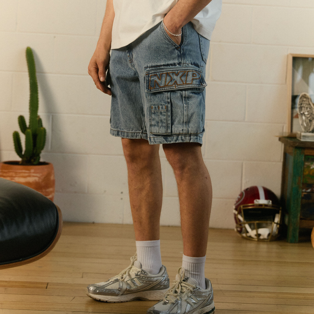 Model Wears Colby Denim Cargo Short Herring Blue Shorts in Blue - Image 2