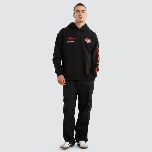Model Wears Essendon Bombers AFL Season Hoodie Jet Black Hoodies in Black - Image 3