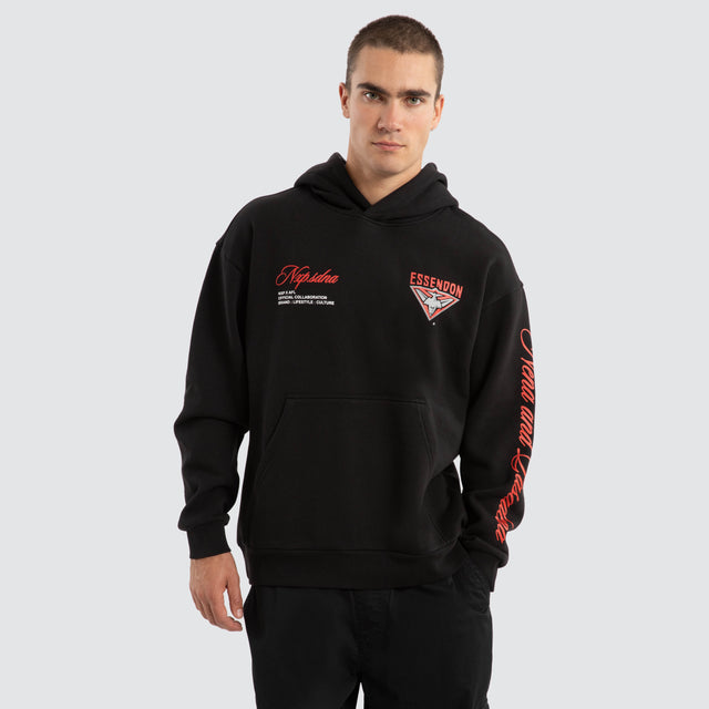 Model Wears Essendon Bombers AFL Season Hoodie Jet Black Hoodies in Black - Image 2
