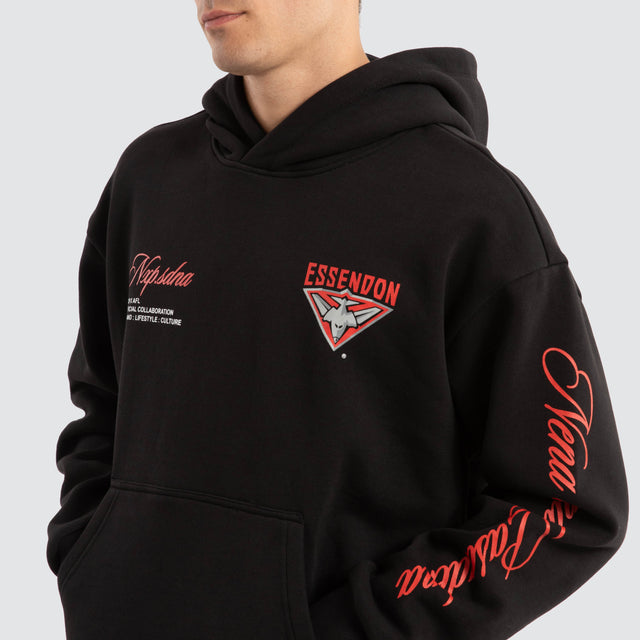 Model Wears Essendon Bombers AFL Season Hoodie Jet Black Hoodies in Black - Image 4