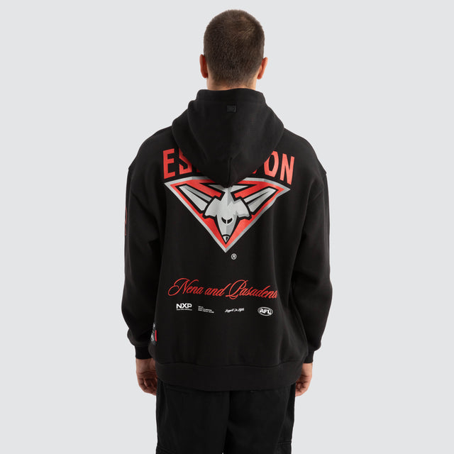 Model Wears Essendon Bombers AFL Season Hoodie Jet Black Hoodies in Black - Image 1
