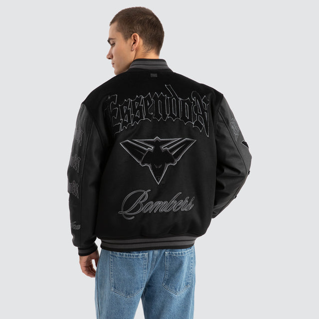 Model Wears Essendon Bombers AFL Ace Varsity Jacket Jet Black Jackets in Black - Image 1