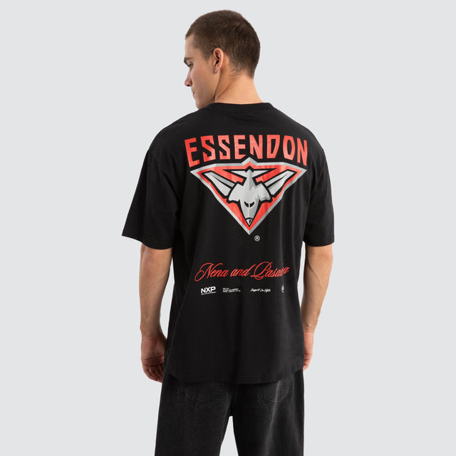 Model Wears Essendon Bombers AFL Season Tee Jet Black T-Shirts in Black - Image 1