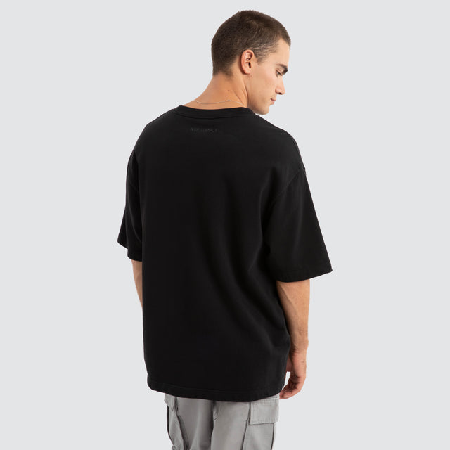 Model Wears Estevan Oversized Loopback Tee Jet Black T-Shirts in Black - Image 4