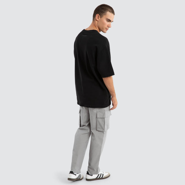 Model Wears Estevan Oversized Loopback Tee Jet Black T-Shirts in Black - Image 5