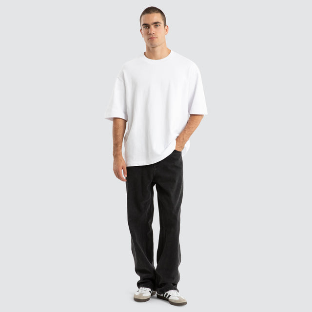 Model Wears Estevan Oversized Loopback Tee Optical White T-Shirts in White - Image 2
