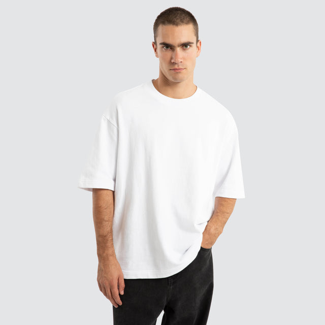 Model Wears Estevan Oversized Loopback Tee Optical White T-Shirts in White - Image 1