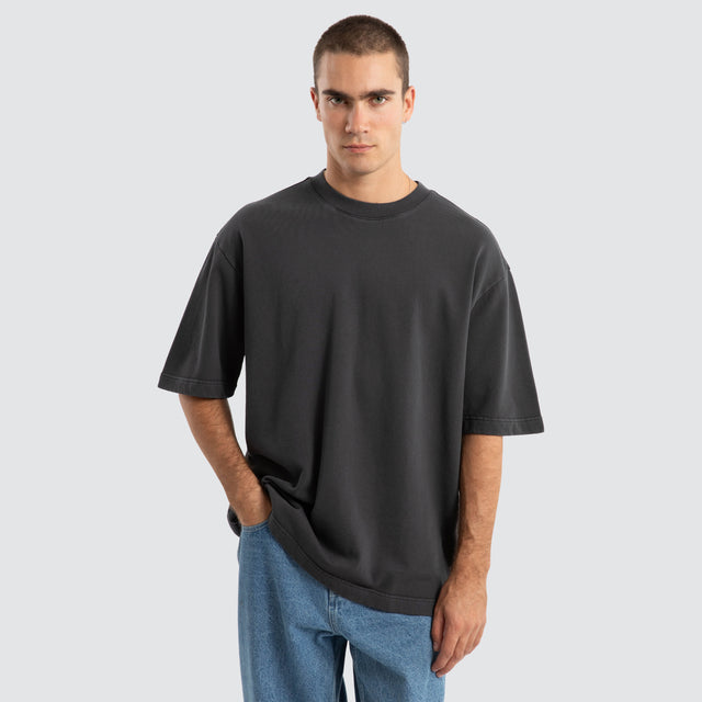 Model Wears Estevan Oversized Loopback Tee Pigment Asphalt T-Shirts in Grey - Image 1