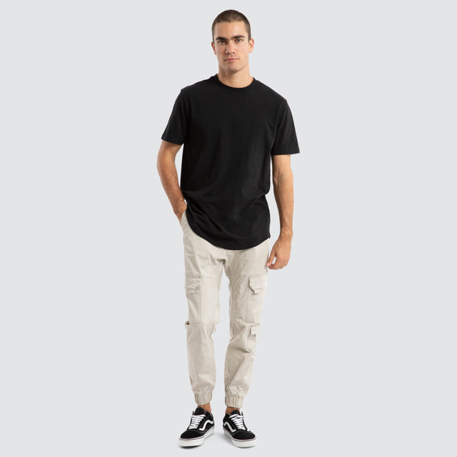Model Wears F100 Cargo Jogger Stone Pants in Off-White - Image 2