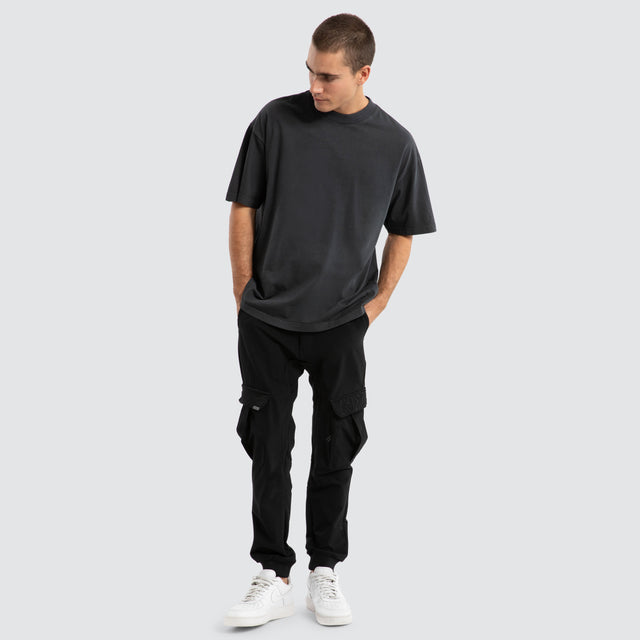 Model Wears F150 Slim Nylon Cargo Jogger Black Pants in Black - Image 2