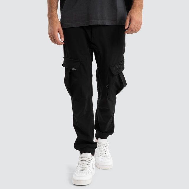 Model Wears F150 Slim Nylon Cargo Jogger Black Pants in Black - Image 1