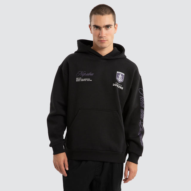 Model Wears Fremantle Dockers AFL Season Hoodie Jet Black Hoodies in Black - Image 2
