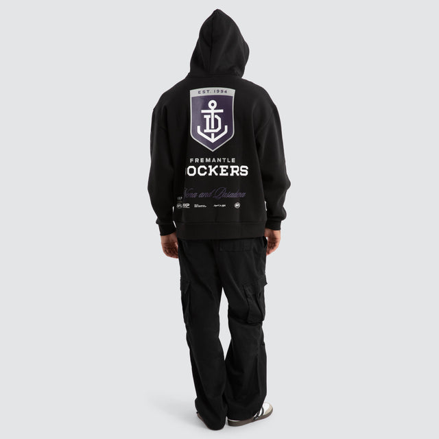 Model Wears Fremantle Dockers AFL Season Hoodie Jet Black Hoodies in Black - Image 5